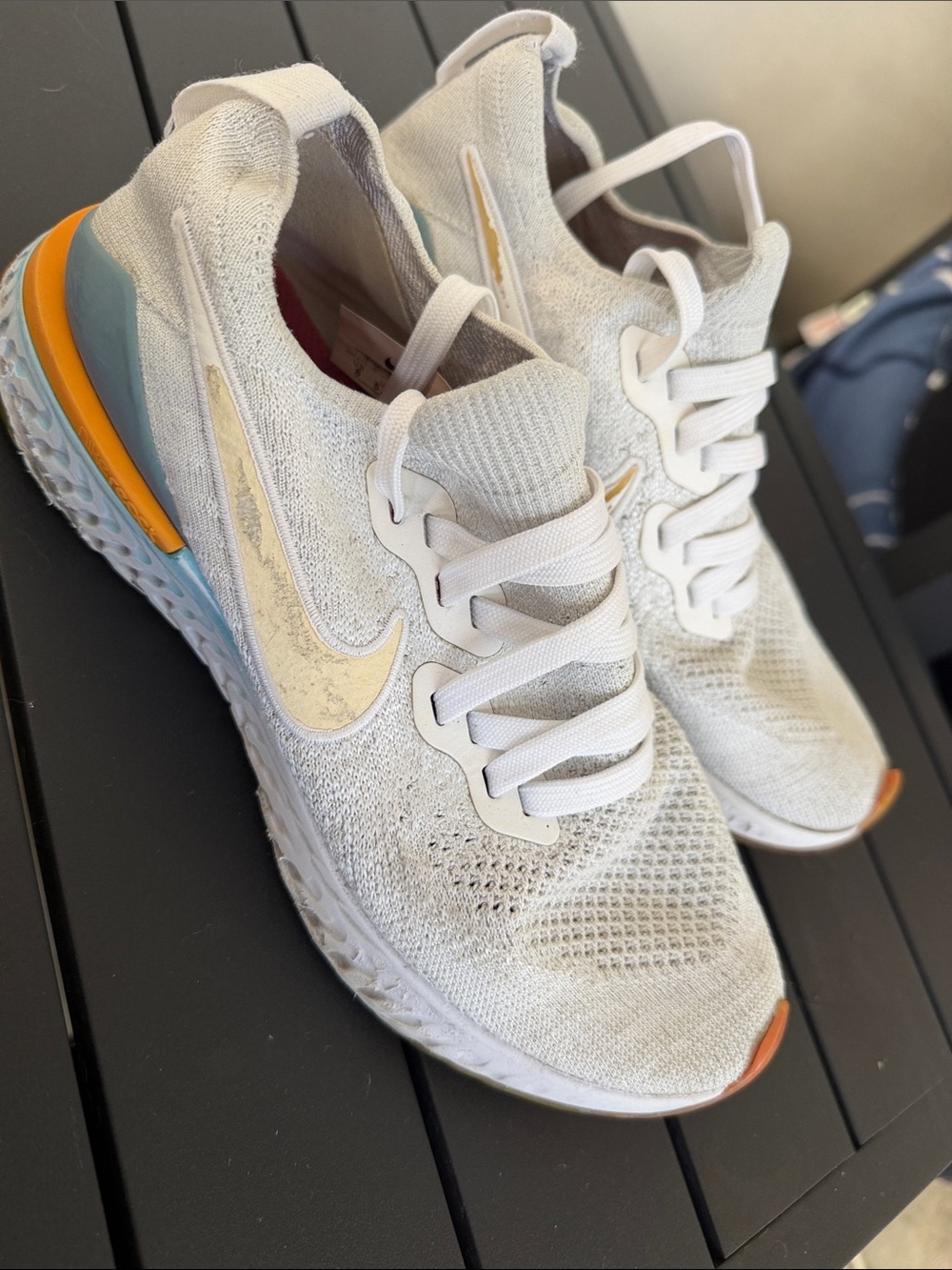 Nike Women's White Knit Running Shoes with Blue & Orange Accents